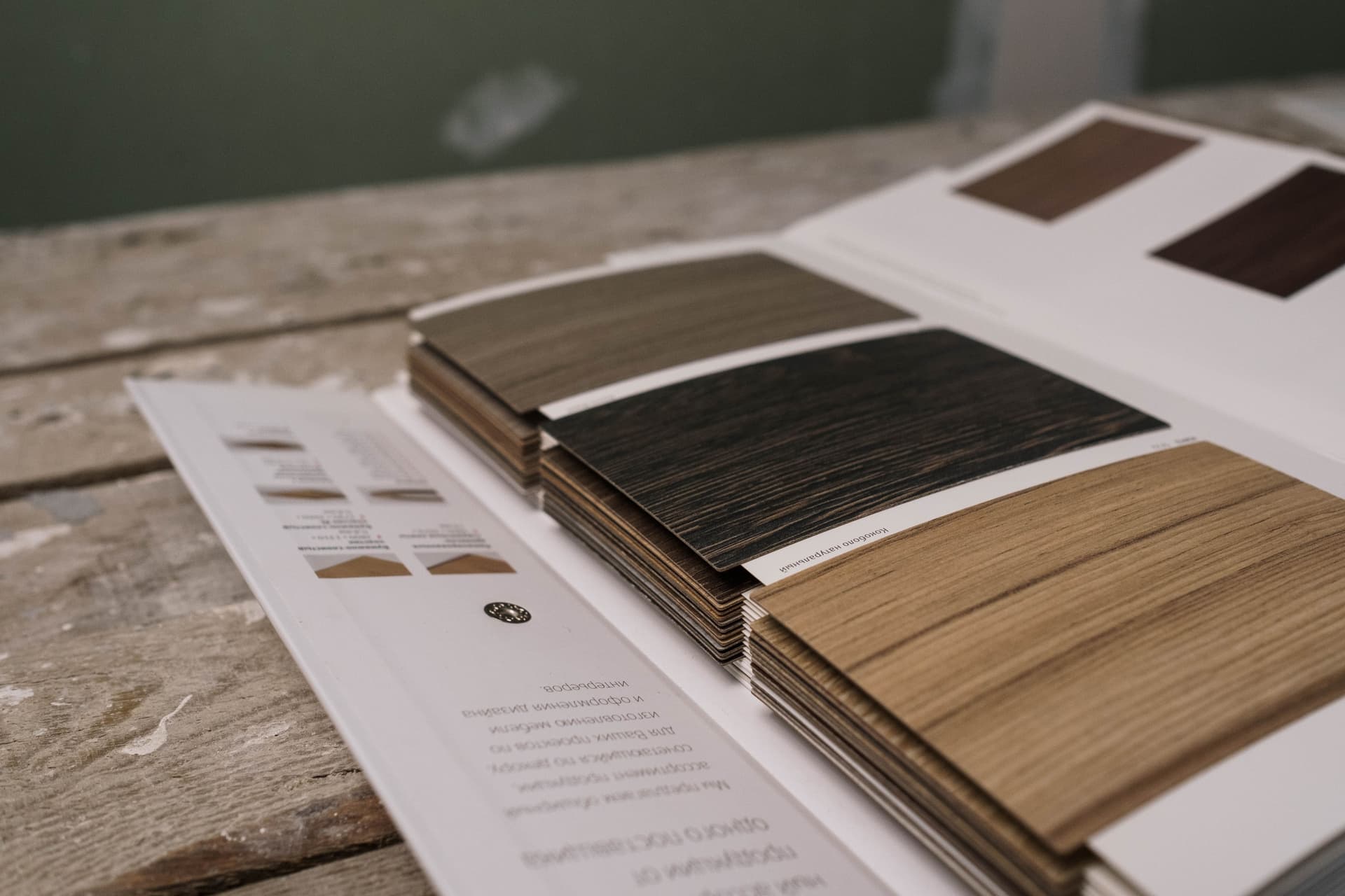 Interior design material samples and specification documents representing furniture specification software workflows