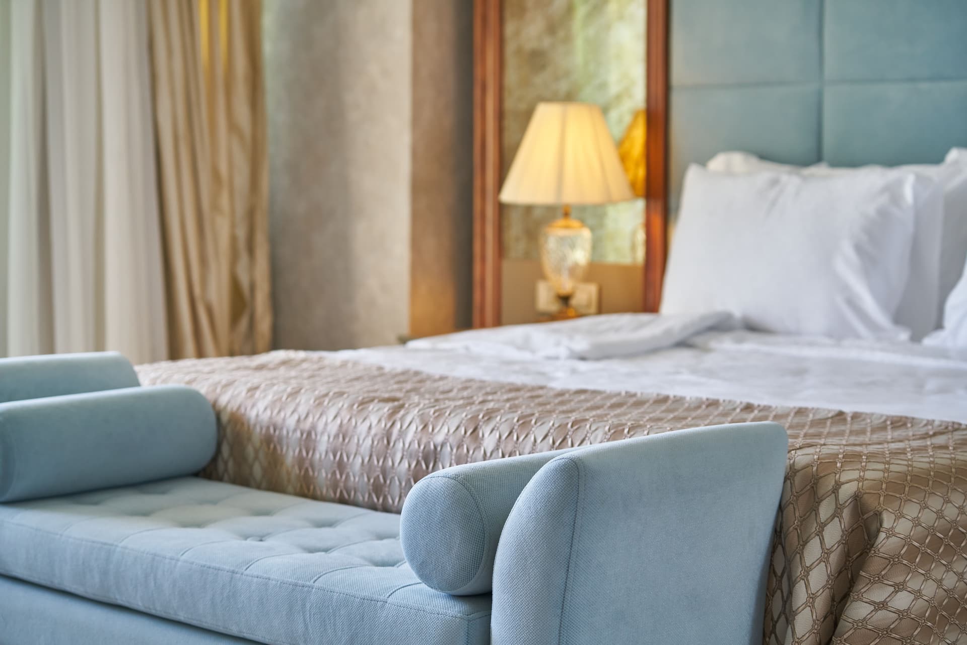 Elegantly designed hotel bedroom representing the interior design specification that goes into hotel FF&E