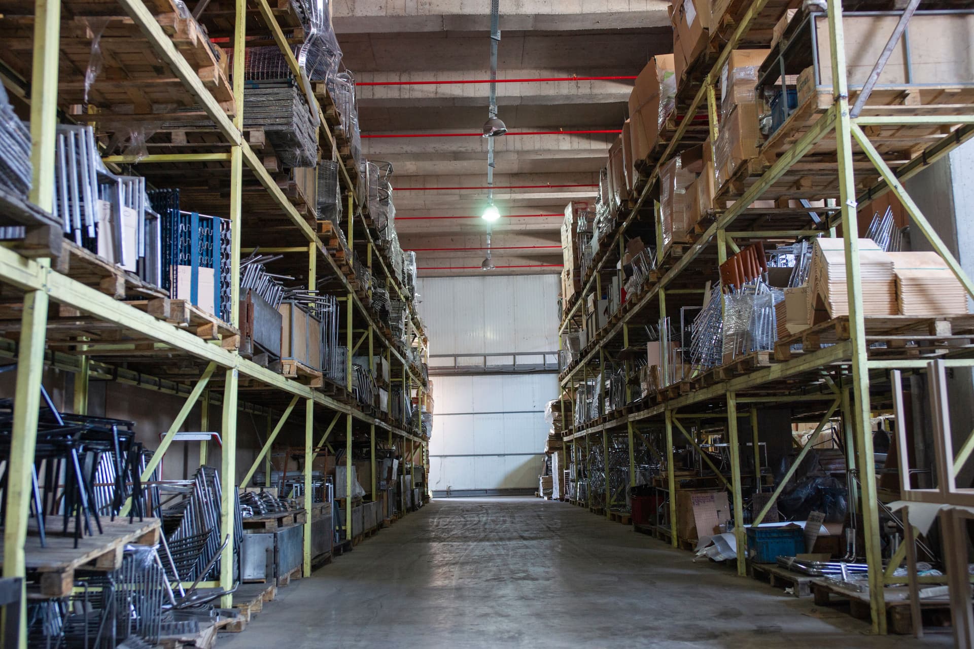 Commercial furniture items in a warehouse ready for installation, representing the logistics of furniture asset tracking